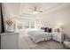 Bright bedroom with many windows, decorative tray ceiling, and neutral decor for a relaxing space at 4220 Cavalier Way, Duluth, GA 30097