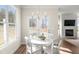 Bright dining area with a modern chandelier and view of the fireplace at 4220 Cavalier Way, Duluth, GA 30097