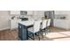 Well-lit kitchen with stainless steel appliances and an island with barstool seating at 4220 Cavalier Way, Duluth, GA 30097