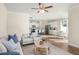 Open-concept layout of living room to kitchen, featuring modern furniture and fixtures at 4220 Cavalier Way, Duluth, GA 30097