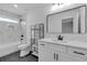 Bright bathroom featuring a tub and shower, black accents, and a framed mirror at 131 Old Alabama Se Rd, Emerson, GA 30137