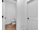Small powder room with a toilet and white door at 131 Old Alabama Se Rd, Emerson, GA 30137