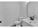 Modern bathroom featuring a pedestal sink with a dark faucet and a toilet at 131 Old Alabama Se Rd, Emerson, GA 30137
