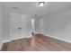 This bedroom features a closet with double doors, wood floors, and a bright window at 131 Old Alabama Se Rd, Emerson, GA 30137