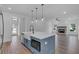 Stylish kitchen with island, stainless steel appliances, and view of the living room fireplace at 131 Old Alabama Se Rd, Emerson, GA 30137