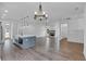 Open-concept living space with kitchen island view, fireplace, and ample natural light at 131 Old Alabama Se Rd, Emerson, GA 30137