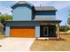 Stylish blue home with a spacious two-car garage and inviting covered patio area at 131 Old Alabama Se Rd, Emerson, GA 30137