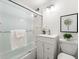 Bathroom featuring tiled walls and a shower with a glass door at 215 Piedmont Ne Ave # 308, Atlanta, GA 30308