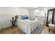 Cozy bedroom with modern decor, light wood floors, and large window view at 215 Piedmont Ne Ave # 308, Atlanta, GA 30308