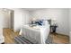 Bright bedroom features modern decor, light wood floors, and ample closet space at 215 Piedmont Ne Ave # 308, Atlanta, GA 30308