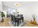 Modern dining room featuring sleek furniture, stylish accents, and light wood floors at 215 Piedmont Ne Ave # 308, Atlanta, GA 30308