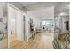 Inviting entryway leading into a bright living room with mirrored accents and light floors at 215 Piedmont Ne Ave # 308, Atlanta, GA 30308