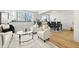 Open-concept living room with hardwood floors and plenty of sunlight at 215 Piedmont Ne Ave # 308, Atlanta, GA 30308