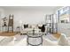 Stylish living room with a modern couch, area rug, and an abundance of natural light at 215 Piedmont Ne Ave # 308, Atlanta, GA 30308