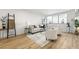 Bright living room with wood floors, area rug, and large windows at 215 Piedmont Ne Ave # 308, Atlanta, GA 30308