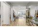 Bright open living room featuring mirrored walls, light wood floors, and neutral decor at 215 Piedmont Ne Ave # 308, Atlanta, GA 30308