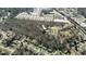 Vast property with a yellow border featuring a residential lot, mature trees, and surrounding houses at 116 Thornton Dr, Jonesboro, GA 30236