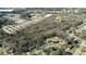 Aerial view showing trees surrounding houses in a residential area near an industrial park at 116 Thornton Dr, Jonesboro, GA 30236