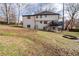 View of the deck and large backyard with a fire pit at 2321 Birdie Ln, Duluth, GA 30096
