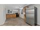 Basement kitchenette with stainless steel refrigerator, sink, cabinets, and modern appliances at 2321 Birdie Ln, Duluth, GA 30096