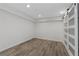 Finished basement room with modern sliding barn doors and wood-look tile flooring at 2321 Birdie Ln, Duluth, GA 30096