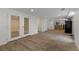 Spacious finished basement with wood-look tile flooring and neutral walls at 2321 Birdie Ln, Duluth, GA 30096