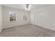 Bedroom with neutral carpet, white walls, a ceiling fan and a double door closet at 2321 Birdie Ln, Duluth, GA 30096