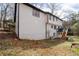 Back exterior of house showing walk out basement and deck at 2321 Birdie Ln, Duluth, GA 30096