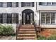 Close up of the home's front door showing the brick stairs and black accents at 2321 Birdie Ln, Duluth, GA 30096