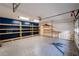 Spacious garage includes shelving and plenty of room for storage at 2321 Birdie Ln, Duluth, GA 30096