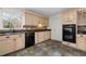 Kitchen features granite countertops, light wood cabinets, tile backsplash, and black appliances at 2321 Birdie Ln, Duluth, GA 30096