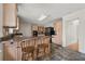 View of the kitchen featuring tile floors, light wood cabinets, and black appliances at 2321 Birdie Ln, Duluth, GA 30096