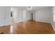 Spacious living room with gleaming hardwood floors and lots of natural light at 2321 Birdie Ln, Duluth, GA 30096