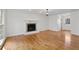 Spacious living room featuring hardwood floors, fireplace and neutral paint at 2321 Birdie Ln, Duluth, GA 30096