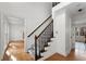 Interior staircase with wood flooring and natural light at 2321 Birdie Ln, Duluth, GA 30096