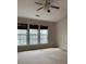 Bright bedroom featuring large windows and neutral carpeting at 2394 Elkhorn Ter, Duluth, GA 30096