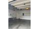 Garage has storage shelving, a door and mirrors along one wall at 2394 Elkhorn Ter, Duluth, GA 30096