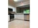 The kitchen has stainless steel appliances, white cabinets, and granite countertops at 2394 Elkhorn Ter, Duluth, GA 30096