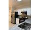 Granite counters and stainless steel appliances are featured in this well-lit kitchen at 2394 Elkhorn Ter, Duluth, GA 30096