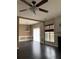 A spacious living area with hardwood floors, a fireplace, and natural light at 2394 Elkhorn Ter, Duluth, GA 30096