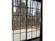 View through the glass door looking out at the patio and backyard space at 2394 Elkhorn Ter, Duluth, GA 30096