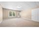 Finished basement with a window, neutral carpet, and an exit to outside at 4002 Turnstone Nw Dr, Kennesaw, GA 30152