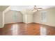 Large main bedroom featuring wood floors, vaulted ceiling and plantation shutters at 4002 Turnstone Nw Dr, Kennesaw, GA 30152