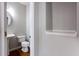 Half-bathroom with a pedestal sink and a decorative shelf at 11338 Musette Cir, Alpharetta, GA 30009