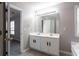 Bathroom features double sinks and a large mirror at 11338 Musette Cir, Alpharetta, GA 30009