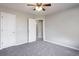 Bedroom featuring neutral walls, carpet and closet access at 11338 Musette Cir, Alpharetta, GA 30009