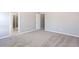 Spacious bedroom with neutral carpet leading to the bathroom at 11338 Musette Cir, Alpharetta, GA 30009