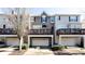 Townhome featuring attached garages and a charming front deck area at 11338 Musette Cir, Alpharetta, GA 30009