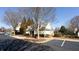 Exterior view of the property with parking and landscaping at 11338 Musette Cir, Alpharetta, GA 30009