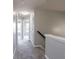 Upstairs hallway features neutral carpet and walls at 11338 Musette Cir, Alpharetta, GA 30009